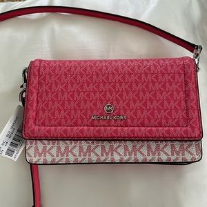 Pink Michael Kors monogram purse/wallet.